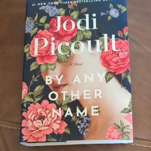 Red and White Coffee Table Book with Floral Accents